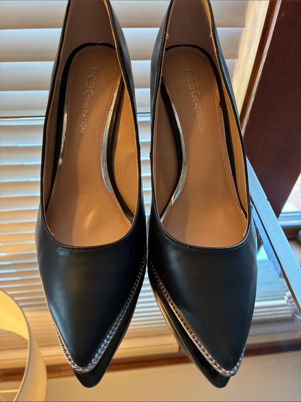 BCBGeneration Black Pointed-Toe Pumps with Silver Accent